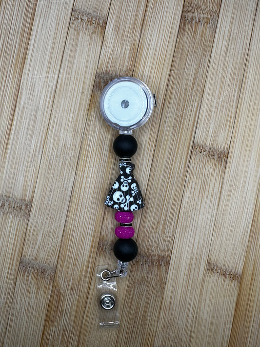 Skull dress badge reel